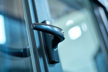 Doorknob with a lock on the glass door.