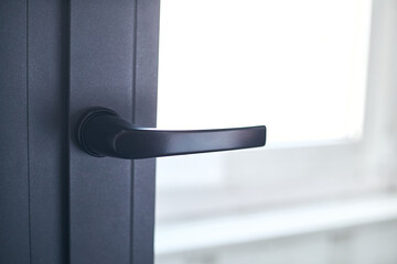 close-up. handle on the balcony window frame.