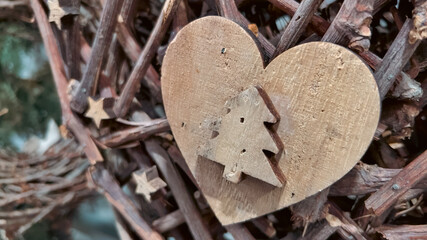 A wooden heart and tree-shaped Christmas decoration