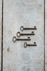 Vintage keys on a wooden board