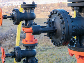 Black painted gas pipe connections close up  shot for industrial background.