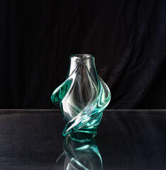 Mid-century modern glass vase isolated on black background