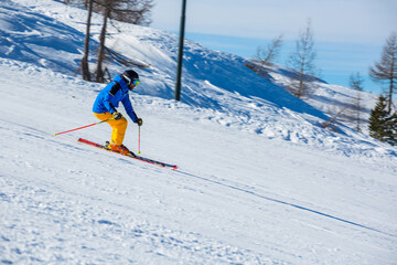 Alpine skier on slope at Cortina
