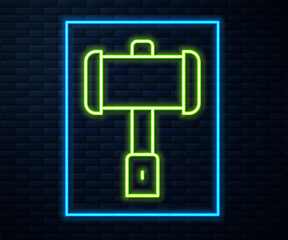 Glowing neon line Medieval battle hammer icon isolated on brick wall background. Vector