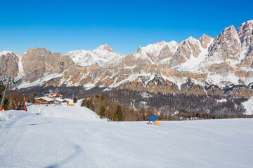 Fototapeta na wymiar Alpine skier on slope at Cortina
