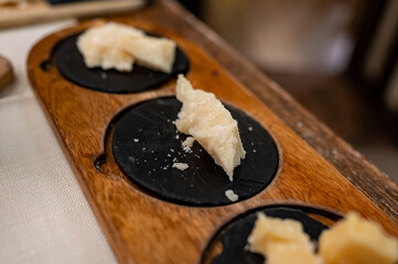Tasting of different matured and old parmesan Parmigiano-Reggiano hard cheese in Parma, Emilia Romagna, Italy