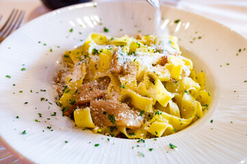 Italian food, firsh course dish, fresh homemade pasta tagliatelle with porcini mushrooms, Parma, Emilia Romagna, Italy