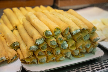 Italian food, fresh home made stuffed pancakes with ricotta cheese and spinach ready to cook, Parma, Emilia Romagna, Italy