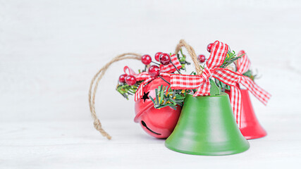 Christmas bells on white wooden background with copy space