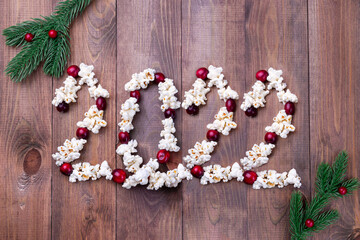 Number 2022 made from traditional popcorn garland with red cranberries, horizontal