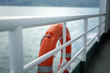 A rescue lifebuoy which is installed on ship corridor rail, stand by for people overboard into the...