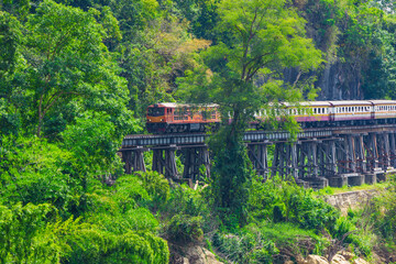 Fototapeta na wymiar Death Railway with train Famous place in Kanchanaburi Thailand