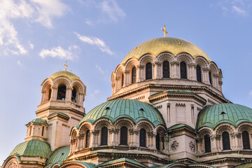 Fototapeta na wymiar Alexander Nevsky cathedral Sofia, Bulgaria. Bulgarian Orthodox cathedral in the capital of Bulgaria. Built in Neo-Byzantine style. Photo taken in a sunset light with trees around