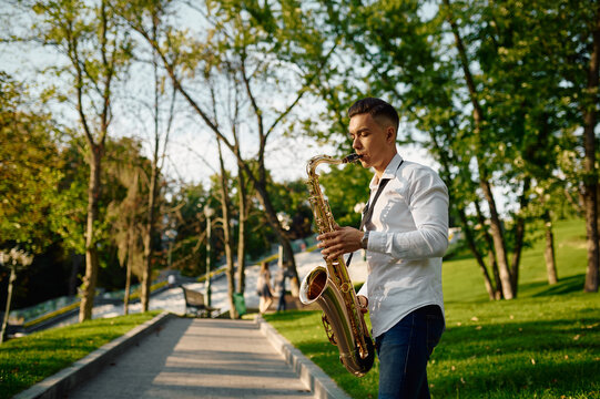 Young Saxophonist Plays The Saxophone In Park