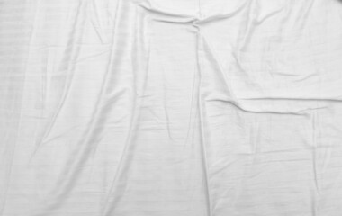 White wrinkled bed background, texture.