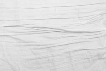 White wrinkled bed background, texture.