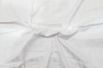 White wrinkled bed background, texture.