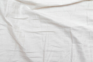 White wrinkled bed background, texture.