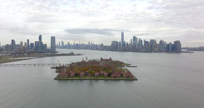Aerial flyover Ellis Island 5k NYC and NJ in background