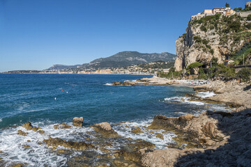 The beautiful Balzi Rossi beach in Ventimiglia with Menton in background