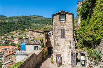 Characteristic small streets in the historic center of Dolceacqua with arches and flowers