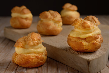 Homemade Profiteroles on cutting board
