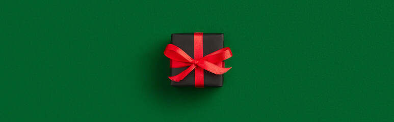 Christmas celebration concept. Gift on green background