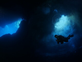sun rays sun beams and sun shine underwater in cave beautiful light scenery in ocean scuba divers to see in cave