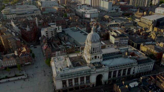 Old Market Square Nottingham. Nottingham City Centre 4k Drone Footage. Looking over the town square and into the distance. Clear, quality 4k drone footage taken at sunset.