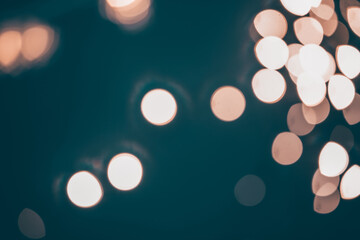 Blurred Christmas lights over dark blue background