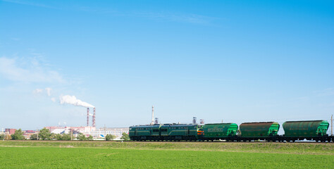 Fototapeta na wymiar Freight train, Belaruskali hopper wagon with edible salt from largest Belarus producers of potash fertilizers in the world. Export of edible salt.
