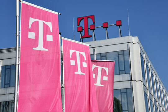 Dusseldorf, North Rhine-Westphalia, Germany - September 9, 2021: Deutsche Telekom flags in Dusseldorf, Germany - Telekom is the largest telecommunications provider in Europe