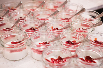 Coconut panna cotta with strawberry sauce. Vegan dessert.