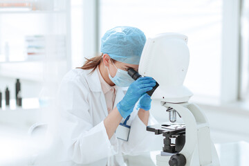 female scientist conducts research in the laboratory.