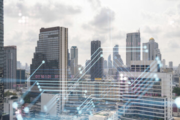 Technology hologram over panorama city view of Bangkok. The largest tech hub in Southeast Asia. The concept of developing coding and high-tech science. Double exposure.