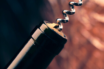 corkscrew opens a bottle of wine, close-up, accessory