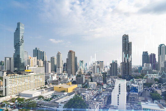 Financial stock chart hologram over panorama city view of Bangkok, business center in Southeast Asia. The concept of international transactions. Double exposure.