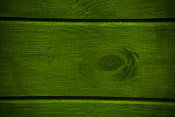 Deska drewniana z sękiem - tekstura , tło . Ściana zielona , drewno . Wooden board with a knot -...