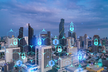 Plakat Hologram of Padlock on sunset panoramic cityscape of Bangkok, Southeast Asia. The concept of cyber security intelligence. Multi exposure.