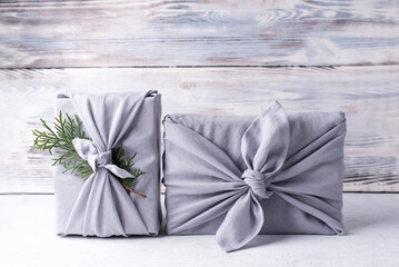 Eco-friendly packaging, Christmas gifts wrapped in linen cloth.