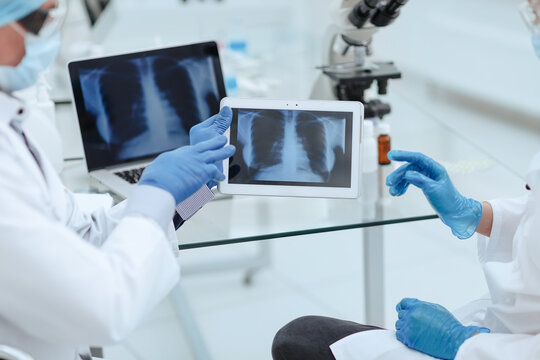 close up. medical colleagues using a digital tablet in the lab .