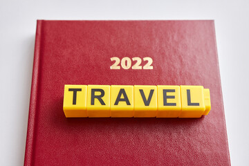 At the top of the 2022 business diary, the word travel consists of letters. Travel in 2022