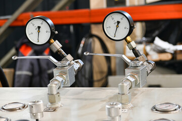 Pressure switching valve of a high-pressure hydraulic oil station with pressure gauges.