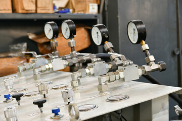 Pressure switching valve of a high-pressure hydraulic oil station with pressure gauges.