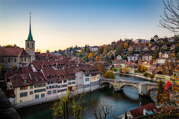 City of Bern with the Untertorbrücke bridge over the Aar river and the Nydeggkirche at sunset