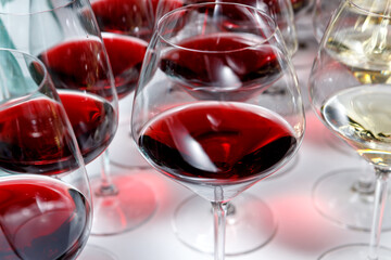 Glass glasses with red and white wine.standing on the table. The concept of the holiday.