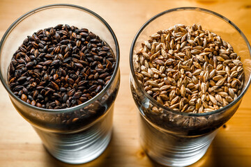 Malt for light and dark beer in glass glasses.