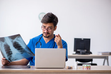 Young male doctor radiologist working in the clinic