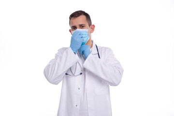 Male Doctor Puts on Medical Mask Isolated. Man Doctor Medical Workwear. Medical Concept