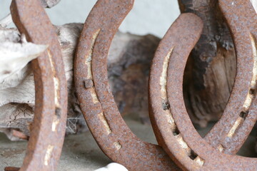 old rusty horseshoe on a wooden background